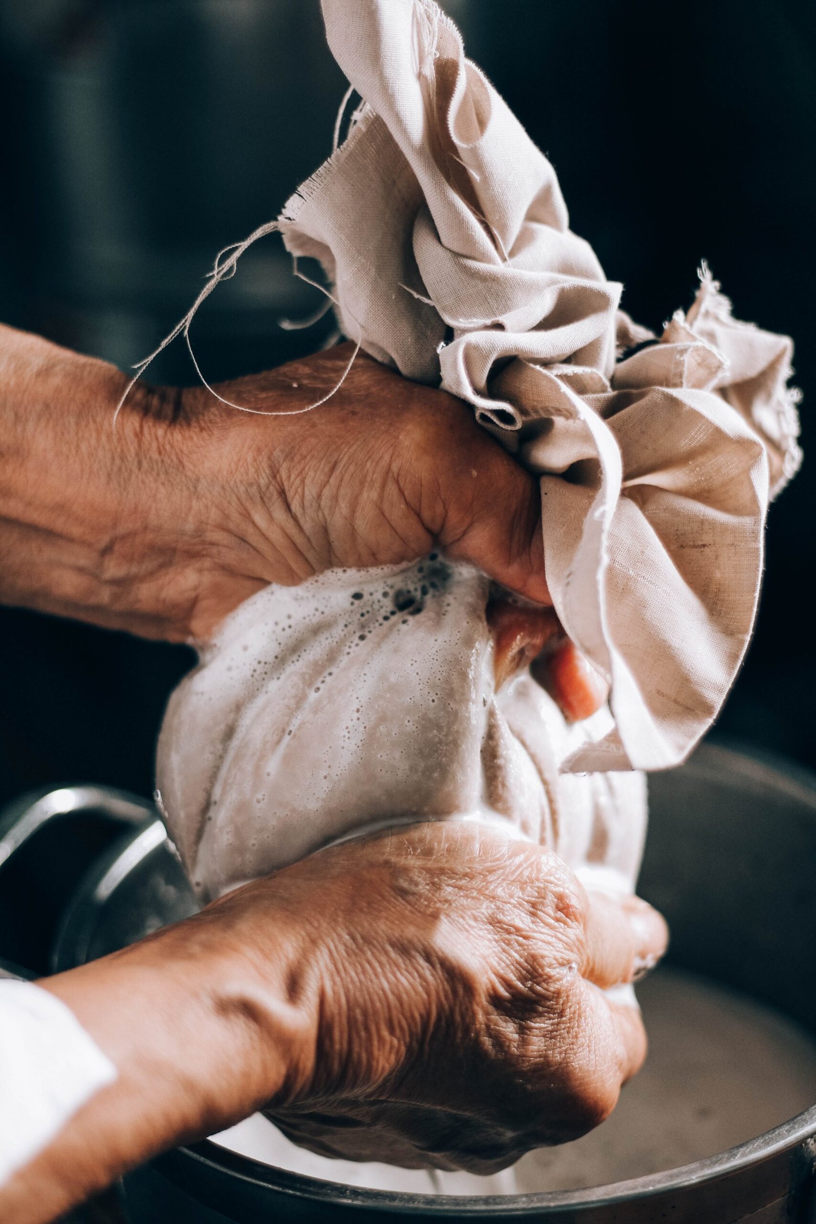 person holding white textile